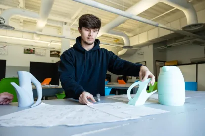NMU art and design student in the human centered design classroom