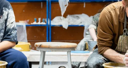 Two NMU students working in the ceramics studio